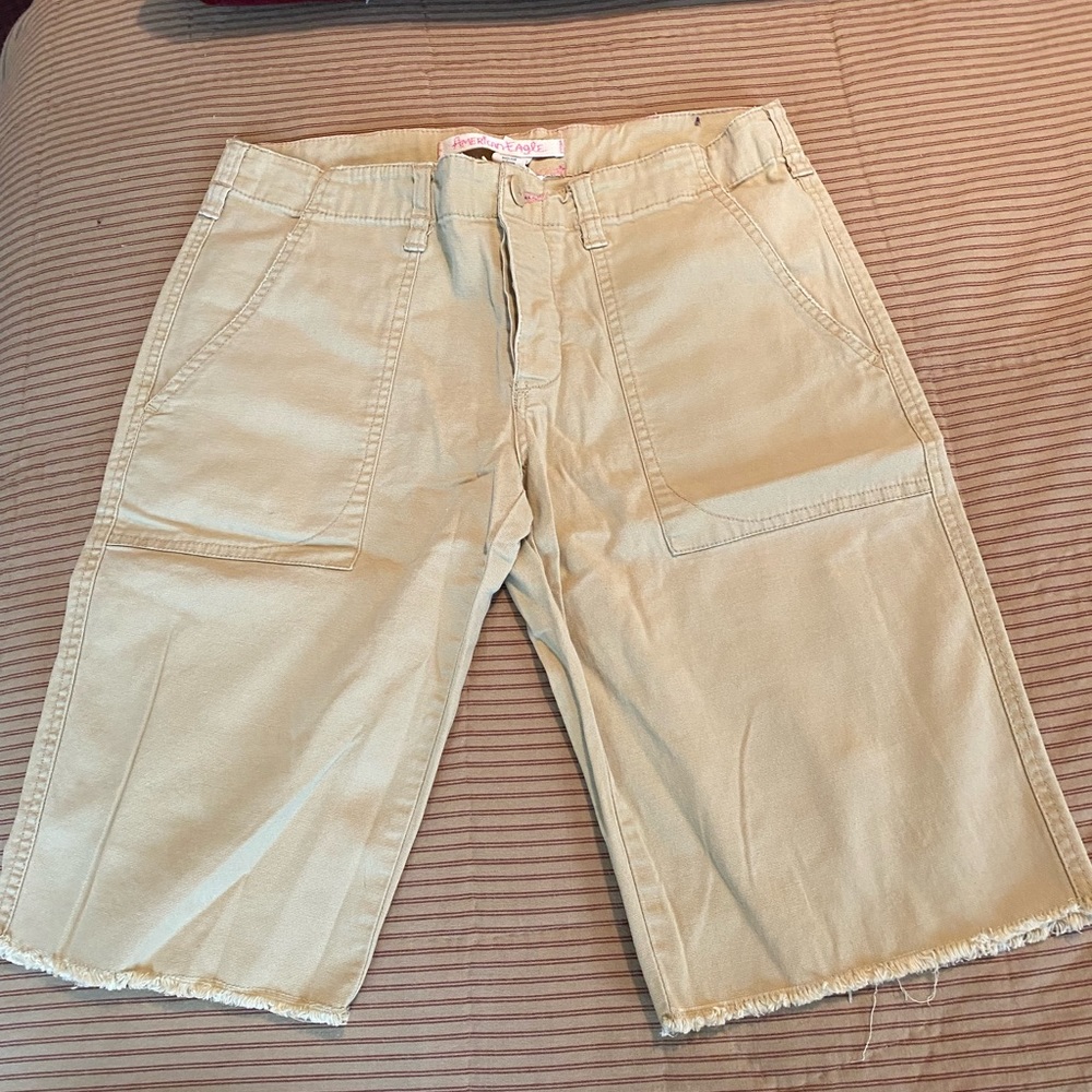 American Eagle Bermuda Shirts. Frayed hem. Khaki color. Size 6. Stretch. Button.